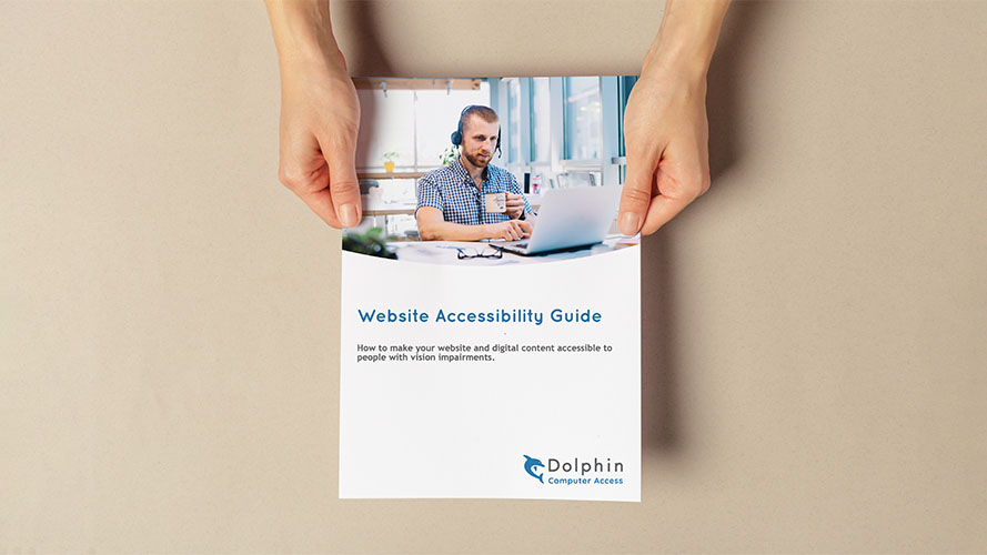 Hands holding a printed copy of the Website Accessibility Guide